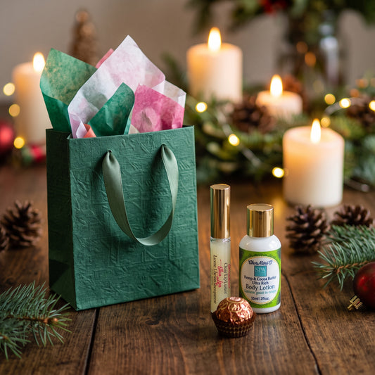 A green gift bag with lip luster, body lotion and a chocolate.