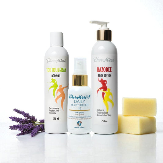 Collection of Cher-Mere products including body oil, lotion, and SPF with shea butter on a white background with lavender.