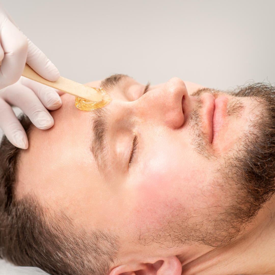 A man getting his brows waxed.
