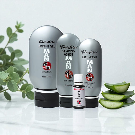 Set of skincare products for men on a white surface with a plant in the background
