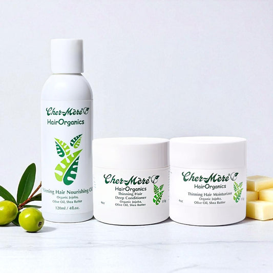 Three bottles of Cher Meré Hair Organics on a white background